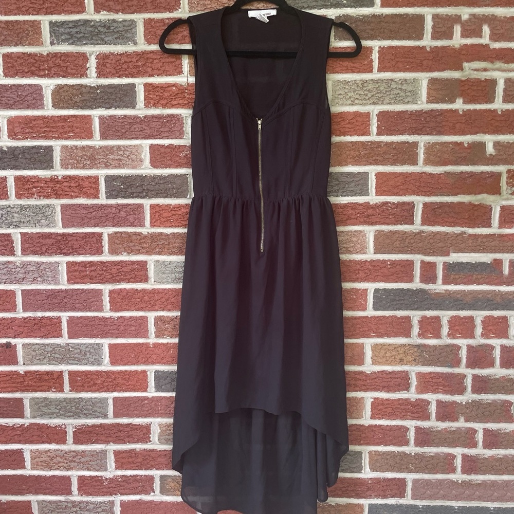 Black Dress with zipper on the chest and open back. Size is a medium.
